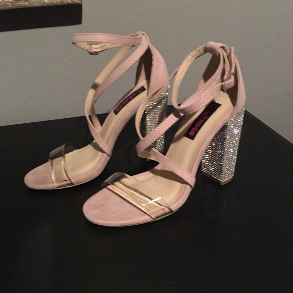 Nude sandals with chunky rhinestone heels.